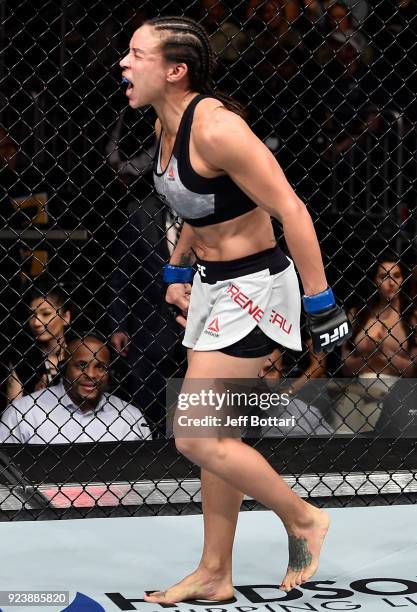 Marion Reneau celebrates after her submission victory over Sara McMann in their women's bantamweight bout during the UFC Fight Night event at Amway...