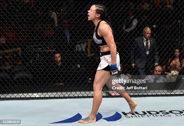 Marion Reneau celebrates after her submission victory over Sara McMann in their women's bantamweight bout during the UFC Fight Night event at Amway...