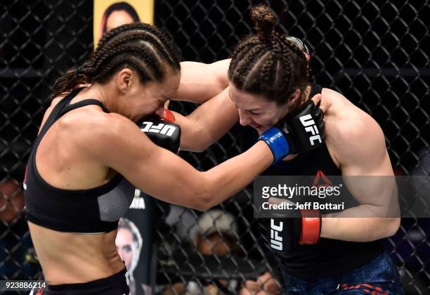 Sara McMann punches Marion Reneau in their women's bantamweight bout during the UFC Fight Night event at Amway Center on February 24, 2018 in...