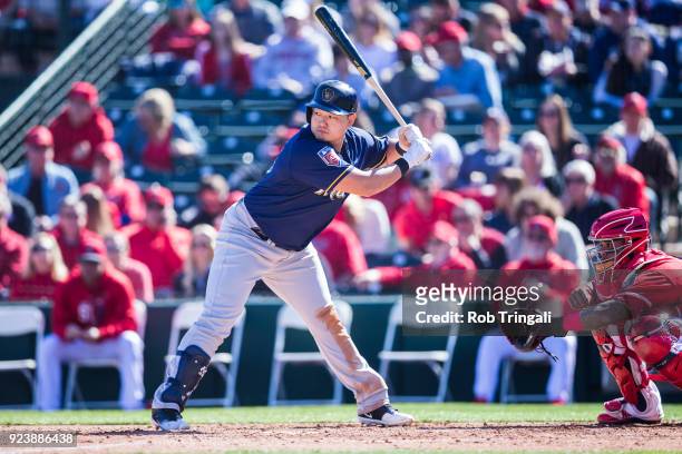 Ji-Man Choi of the Milwaukee Brewers bats against the Los Angeles Angels of Anaheim during a Spring Training Game at Goodyear Ballpark on February...