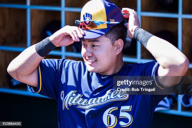 Ji-Man Choi of the Milwaukee Brewers looks on against the Los Angeles Angels of Anaheim during a Spring Training Game at Goodyear Ballpark on...