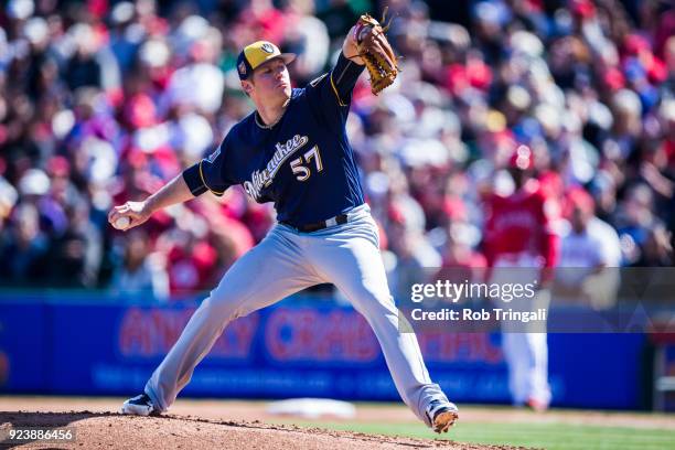 Chase Anderson of the Milwaukee Brewers looks on before a Spring Training Game against the Los Angeles Angels of Anaheim at Goodyear Ballpark on...