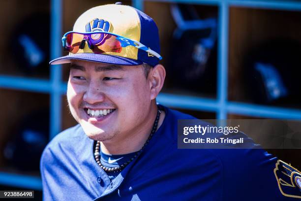 Ji-Man Choi of the Milwaukee Brewers looks on against the Los Angeles Angels of Anaheim during a Spring Training Game at Goodyear Ballpark on...