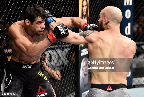 Renan Barao of Brazil and Brian Kelleher trade punches in their bantamweight bout during the UFC Fight Night event at Amway Center on February 24,...
