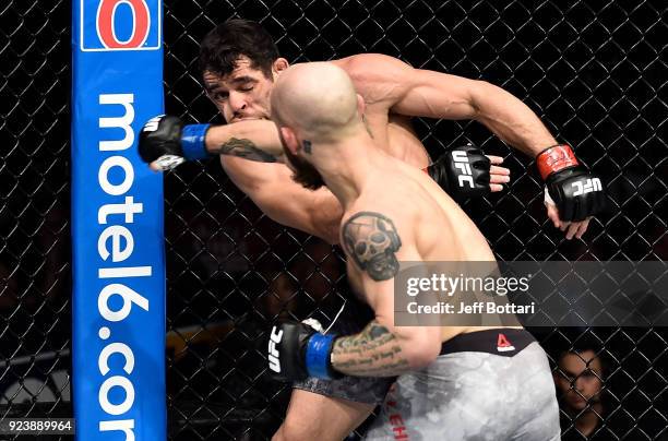 Brian Kelleher punches Renan Barao of Brazil in their bantamweight bout during the UFC Fight Night event at Amway Center on February 24, 2018 in...