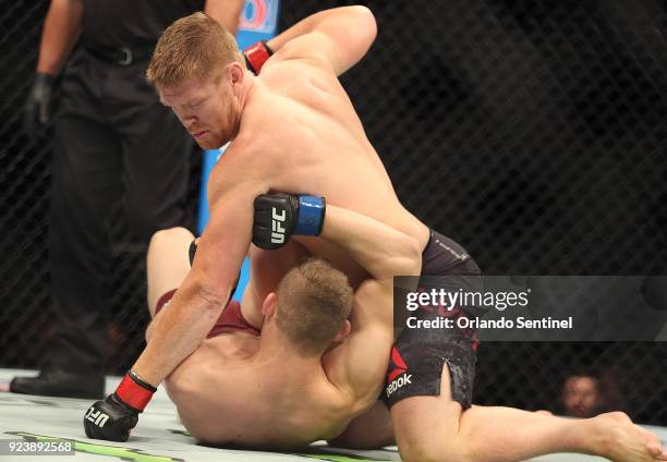 "Smilin''' Sam Alvey, top, beats Marcin Prachnio during UFC Fight Night at the Amway Center in Orlando, Fla., on Saturday, Feb 24, 2018.
