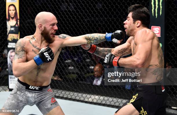 Brian Kelleher punches Renan Barao of Brazil in their bantamweight bout during the UFC Fight Night event at Amway Center on February 24, 2018 in...