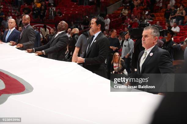 Head Coach Erik Spoelstra of the Miami Heat holds the Marjory Stoneman Douglas HS flag prior to the game against the Memphis Grizzlies on February...