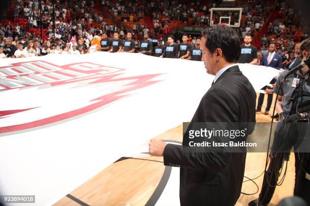 Head Coach Erik Spoelstra of the Miami Heat holds the Marjory Stoneman Douglas HS flag prior to the game against the Memphis Grizzlies on February...
