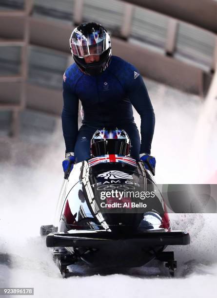 Lamin Deen, Ben Simons, Toby Olubi and Andrew Matthews of Great Britain finish their run during the 4-man Boblseigh Heats on day sixteen of the...