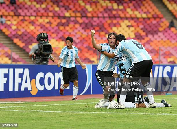 Esteban Espindola of Argentina celebrates with his team mates after scoring his team's first goal during the FIFA U17 World Cup Group A match between...