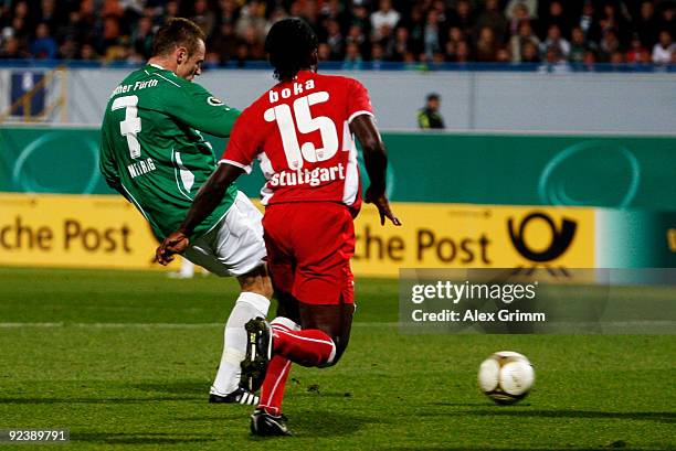 Bernd Nehrig of Greuther Fuerth scores his team's first goal against Arthur Boka of Stuttgart during the DFB Cup match between SpVgg Greuther Fuerth...