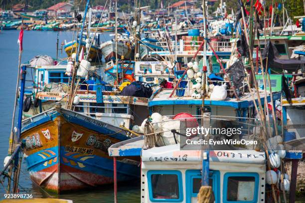 Cityview with harbour and fishing boats, sandy beach, souvenir shops on February 13, 2014 in Negombo, Sri Lanka.