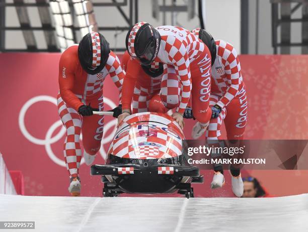 Croatia's Drazen Silic leads his team in the 4-man bobsleigh heat 3 run during the Pyeongchang 2018 Winter Olympic Games, at the Olympic Sliding...