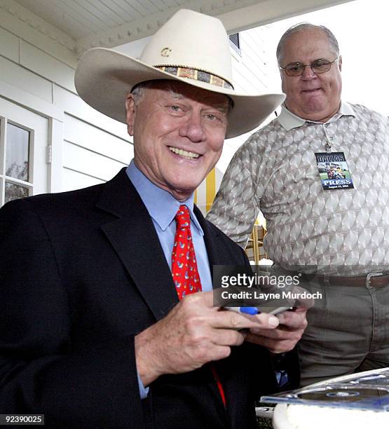 "Dallas" cast member Larry Hagman signs DVDs at the "Dallas" Seasons 1 & 2 DVD Launch Party at South Fork Ranch in Dallas on August 19, 2004.