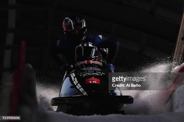 Lamin Deen, Ben Simons, Toby Olubi and Andrew Matthews of Great Britain finish their run during the 4-man Boblseigh Heats on day sixteen of the...