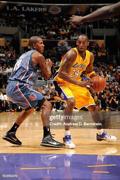 Kobe Bryant of the Los Angeles Lakers goes up against Raja Bell of the Charlotte Bobcats during the preseason game on October 17, 2009 at Staples...