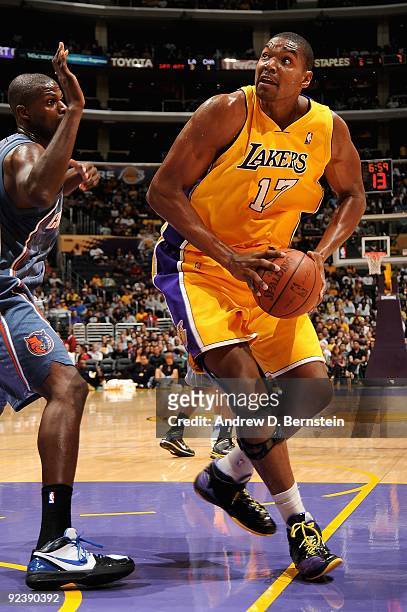 Andrew Bynum of the Los Angeles Lakers moves around Nazr Mohammed of the Charlotte Bobcats during the preseason game on October 17, 2009 at Staples...