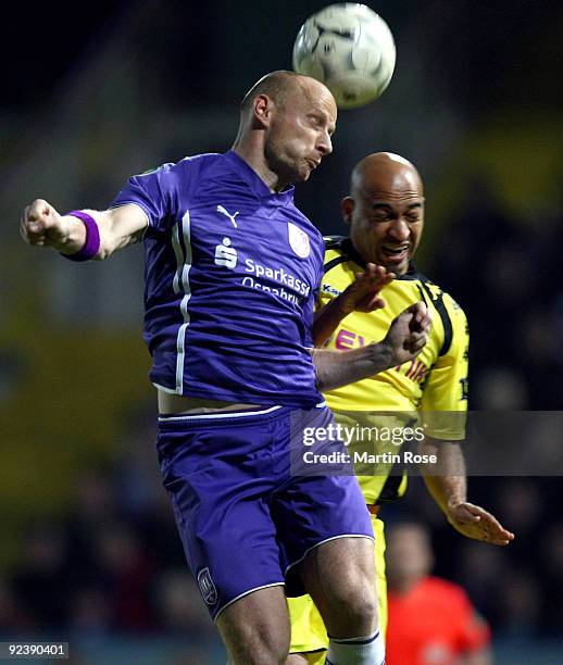 Matthias Heidrich of Osnabruck and Dede of Dortmund battles for the ball during the DFB Cup third round match between VfL Osnabrueck and Borussia...