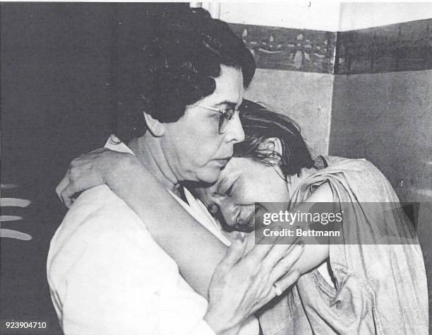 Mrs. Isobel Dyer, wife of Albert Dyer, declared guilty today of the attack murders of three Inglewood children, sobs on the shoulder of matron Vada...