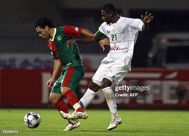 Al-Uruba's Mohammed al-Mokheni vies for the ball with Al-Ittifaq's Bashar al-Ashur during their GCC Clubs Championship football match in Dammam on...