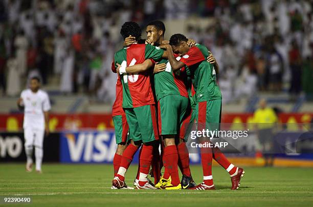 Oman's Al-Uruba club players celebrate after scoring a second goal against Saudi Arabia's Al-Ittifaq during their GCC Clubs Championship football...