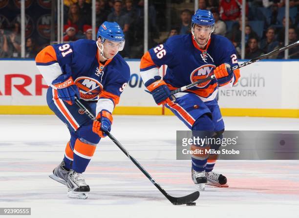Matt Moulson and John Tavares of the New York Islanders skate against the Washington Capitals on October 24, 2009 at Nassau Coliseum in Uniondale,...
