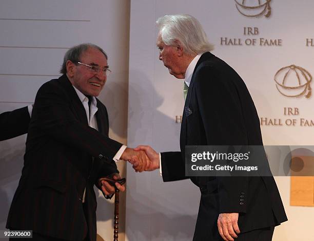 Sir Tony O'Reilly, the former Ireland and Lions international shakes hands with Cliff Morgan the former Wales and Lions international during the IRB...