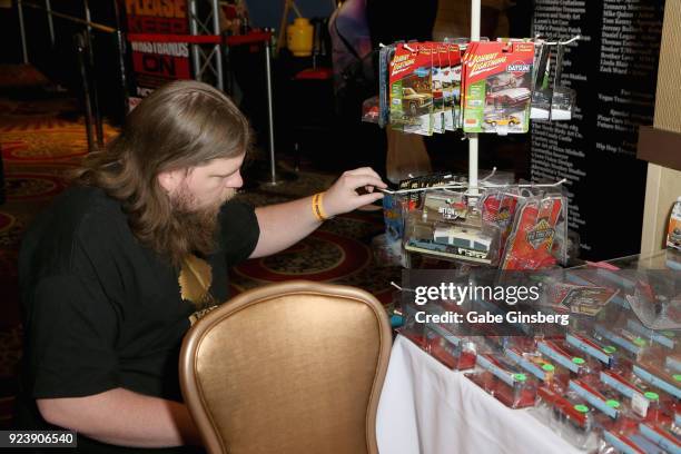Josiah Higginson of Arizona looks at die-cast toy cars during Vegas Toy Con at the Circus Circus Las Vegas on February 24, 2018 in Las Vegas, Nevada.