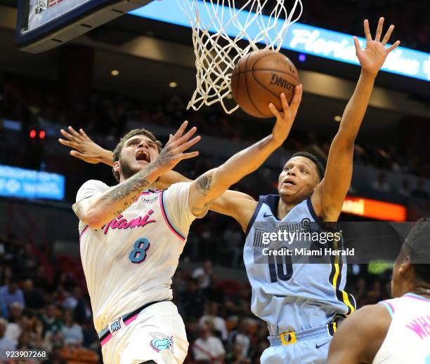 The Miami Heat's Tyler Johnson drives to the basket as the Memphis Grizzlies' Ivan Rabb defends in the first quarter at the AmericanAirlines Arena in...