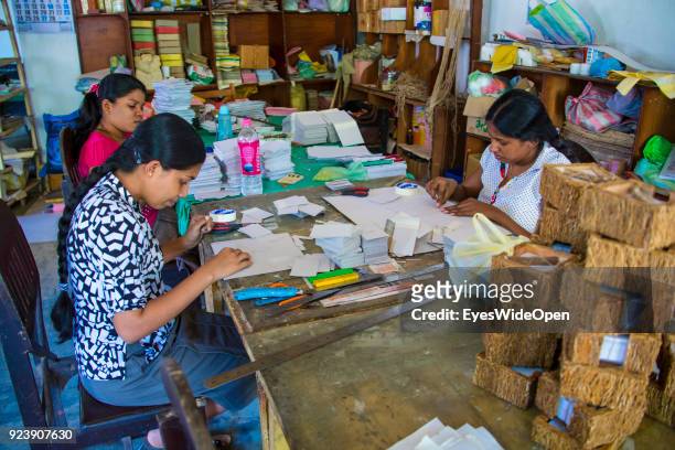 Female worker produce souvenir cards made from dung, at elephant orphanage, Millennium Elephant Foundation on February 22, 2014 in Pinnawela, Sri...