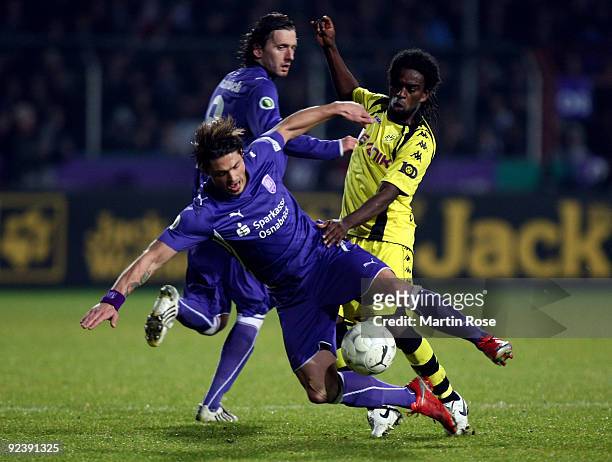 Bjoern Lindemann of Osnabruck and Tinga of Dortmund battle for the ball during the DFB Cup third round match between VfL Osnabrueck and Borussia...
