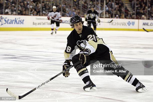 Eric Godard of the Pittsburgh Penguins skates against the New Jersey Devils at Mellon Arena on October 24, 2009 in Pittsburgh, Pennsylvania. Devils...