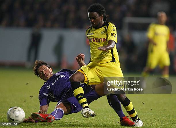 Bjoern Lindemann of Osnabruck and Tinga of Dortmund battles for the ball during the DFB Cup third round match between VfL Osnabrueck and Borussia...