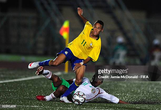 Neymar of Brazil is tackled by Gil Cordero of Mexico during the FIFA U17 World Cup match between Brazil and Mexico at the Teslim Balogun Stadium on...