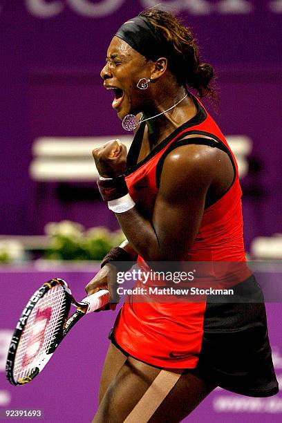 Serena Williams of the United States celebrates match point against Svetlana Kuznetsova of Russia in game one of round robin play during the Sony...