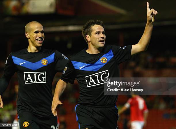 Michael Owen of Manchester United celebrates with Gabriel Obertan after scoring the second goal during the Carling Cup 4th Round match between...