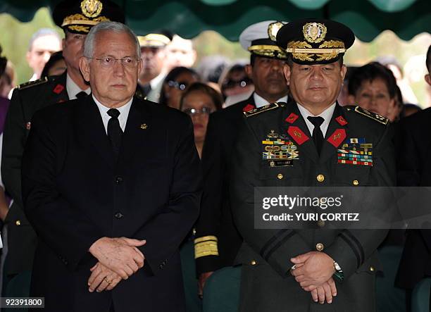 Honduran de facto president Roberto Micheletti stands next to the Chief of the Honduran Armed Forces, General Romeo Vasquez Velasquez on October 27...