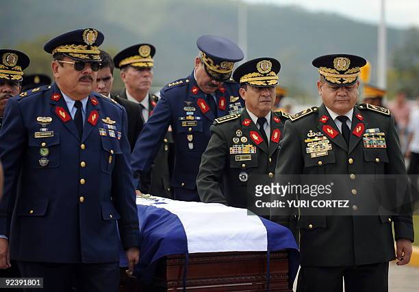 The Chief of the Honduran Armed Forces, General Romeo Vasquez Velasquez and others offcials accompany the coffin with the body of Colonel Concepcion...