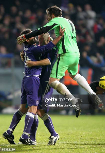 Tino Berbig , goalkeeper of Osnabruck celebrates with team mates Angelo Barletta and Matthias Heidrich after the DFB Cup third round match between...