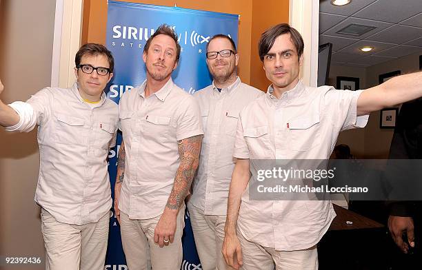 Vocalist Rivers Cuomo, bassist Scott Shriner, drummer Patrick Wilson and guitarist Brian Bell of Weezer pose backstage follwoing their performance on...