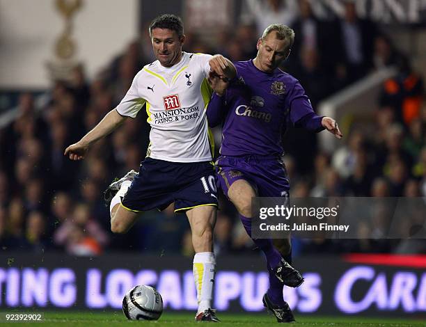 Robbie Keane of Spurs battles with Tony Hibbert of Everton during the Carling Cup 4th Round match between Tottenham Hotspur and Everton at White Hart...