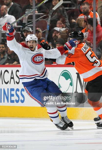 Making his NHL debut, Oskar Lindblom of the Philadelphia Flyers battles against Phillip Danault of the Montreal Canadiens on February 20, 2018 at the...