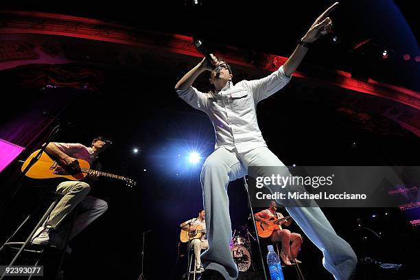 Vocalist Rivers Cuomo and guitarist Brian Bell, guest guitarist Jim McGorman, drummer Patrick Wilson and bassist Scott Shriner Weezer perform on...