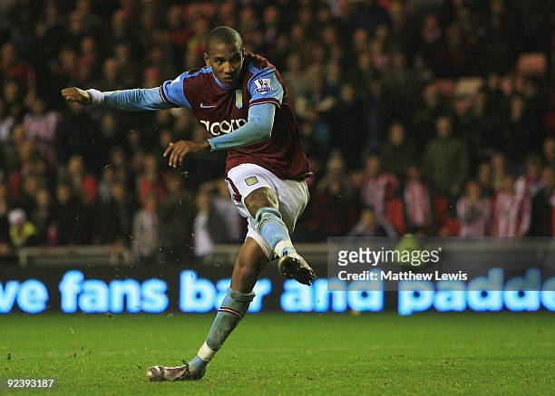 Ashley Young of Aston Villa scores the winning penalty during the Carling Cup 4th Round match between Sunderland and Aston Villa at the Stadium of...