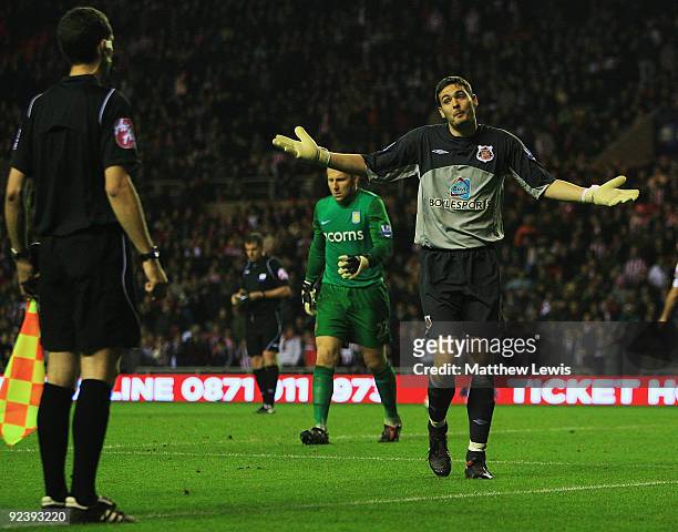 Craig Gordon of Sunderland comes to the linesman, during the penalty shoot out during the Carling Cup 4th Round match between Sunderland and Aston...