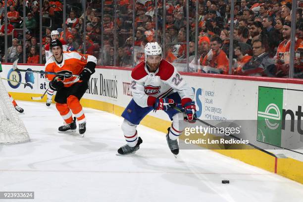 Karl Alzner of the Montreal Canadiens skates the puck against Dale Weise of the Philadelphia Flyers on February 20, 2018 at the Wells Fargo Center in...