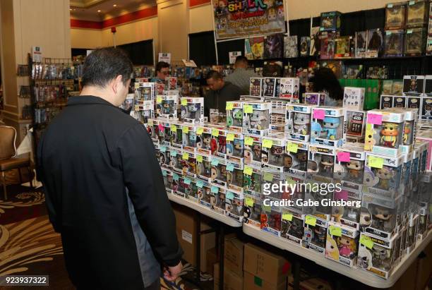 Randy Okazaki of Nevada looks at Pop! Vinyl figurines during Vegas Toy Con at the Circus Circus Las Vegas on February 24, 2018 in Las Vegas, Nevada.