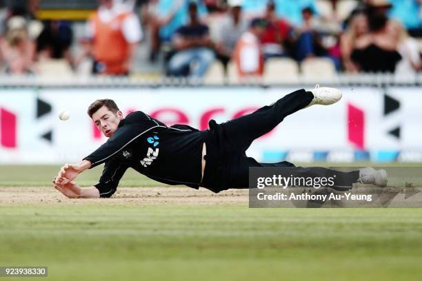 Mitchell Santner of New Zealand dives to field his own bowl during game one in the One Day International series between New Zealand and England at...