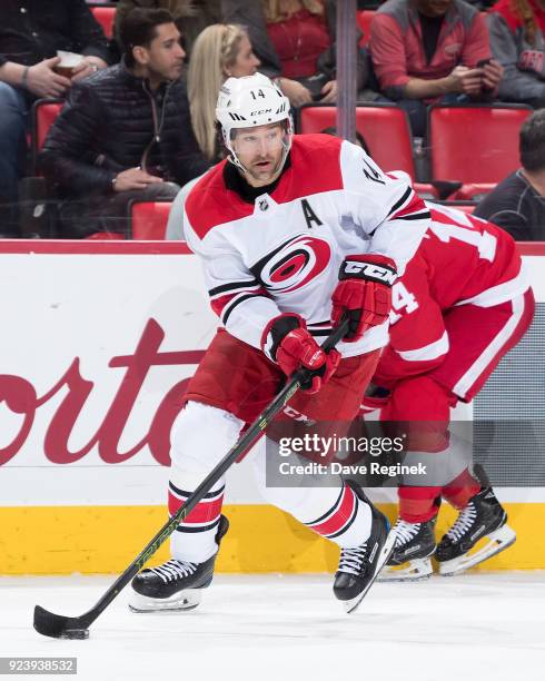 Justin Williams of the Carolina Hurricanes skates with the puck during an NHL game against the Detroit Red Wings at Little Caesars Arena on February...